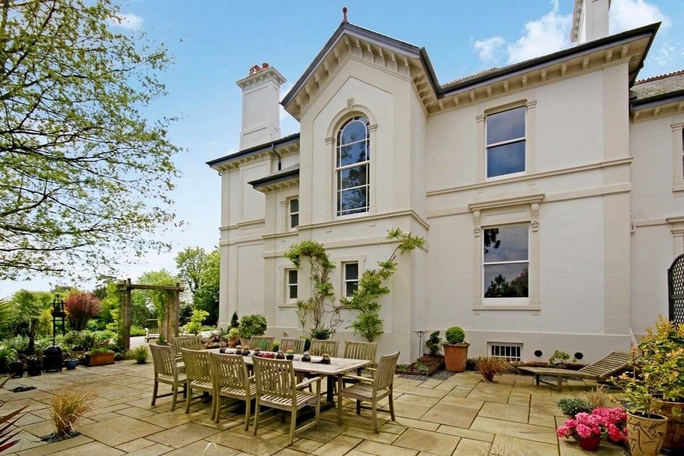 Example of a huge classic two-story house exterior design in Devon