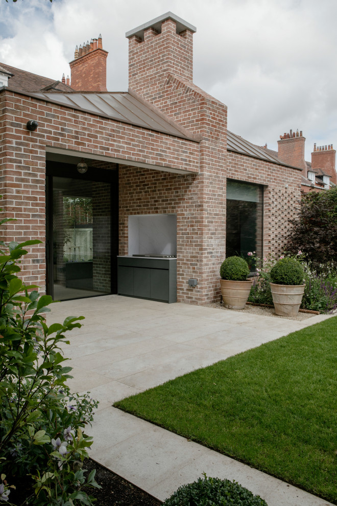 Inspiration for a large and red classic brick detached house in Dublin with three floors and a metal roof.