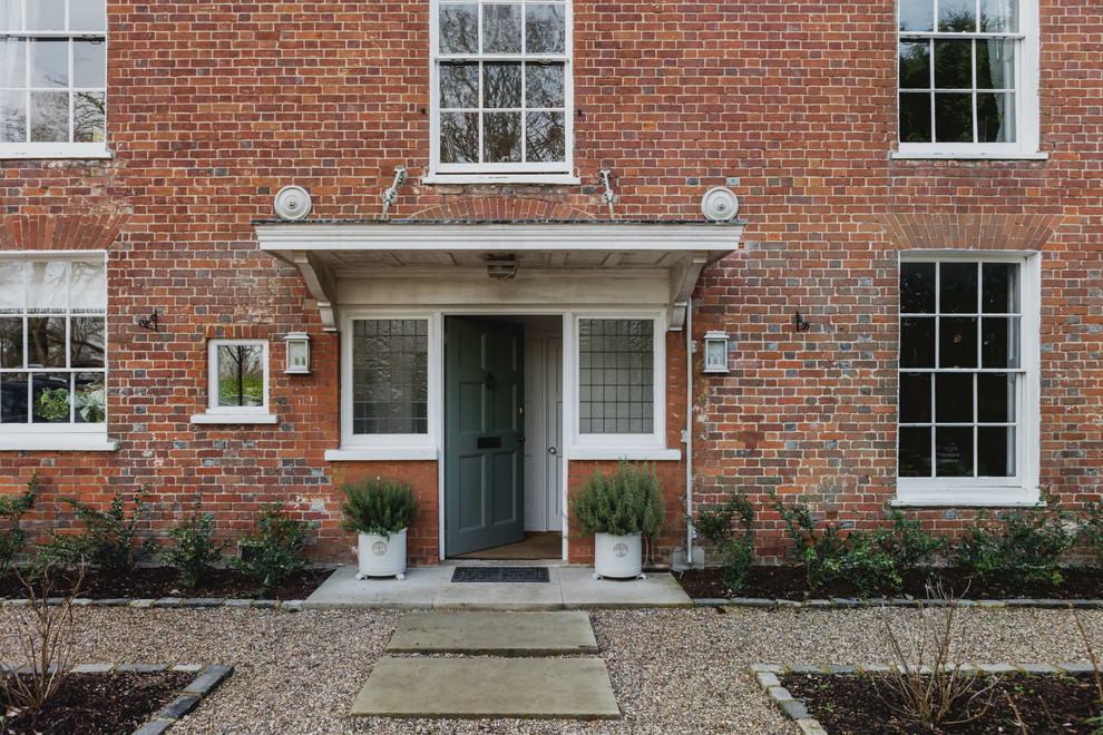 Inspiration for a large and red traditional two floor brick detached house in Berkshire.