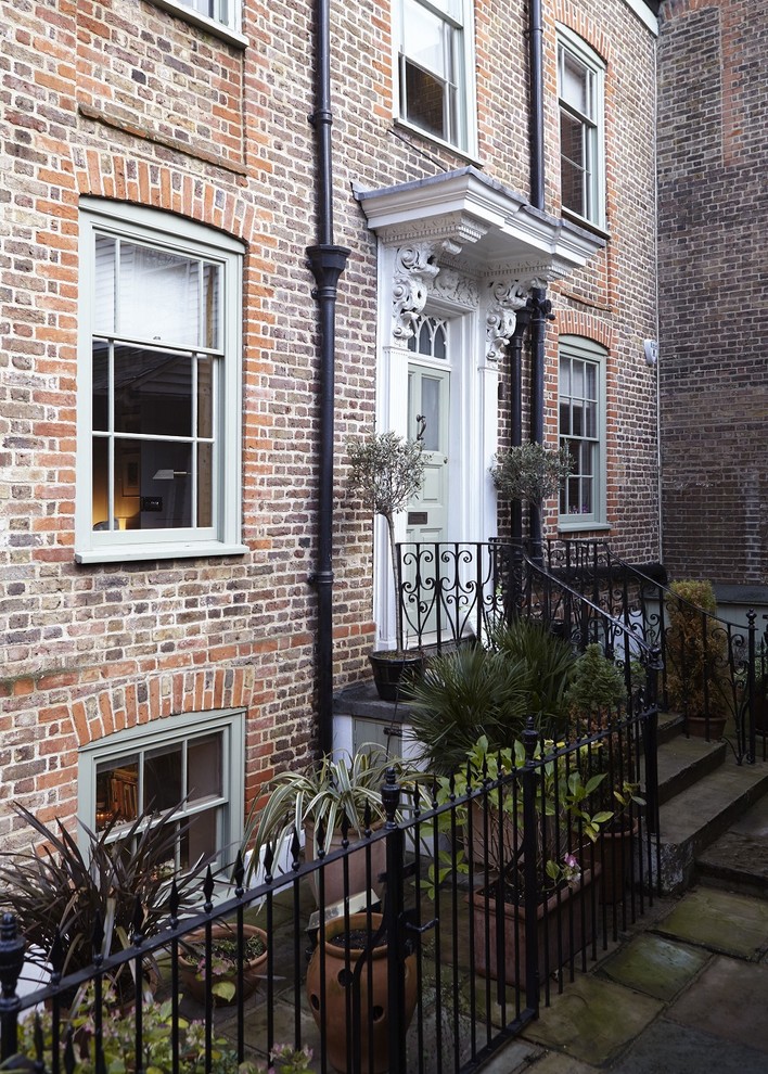 Example of a transitional exterior home design in London