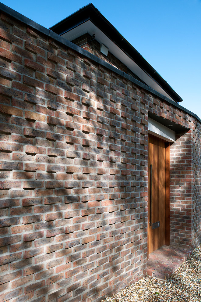 Design ideas for a classic two floor brick house exterior in Hampshire.