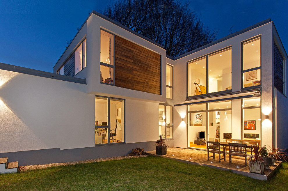 Example of a trendy wood exterior home design in Hampshire
