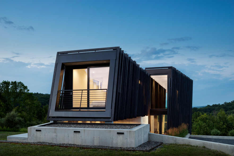 Example of a minimalist black house exterior design in New York