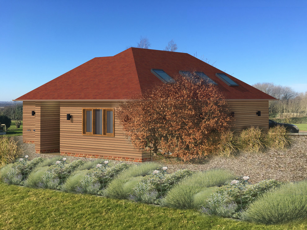 Ejemplo de fachada de casa contemporánea de una planta con revestimiento de madera, tejado a dos aguas y tejado de teja de barro