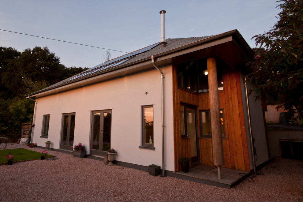 This is an example of a medium sized contemporary house exterior in Devon.