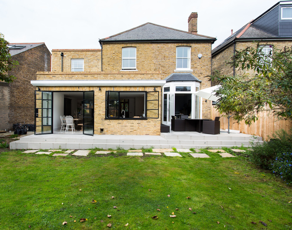 Design ideas for a medium sized classic bungalow brick house exterior in Surrey.