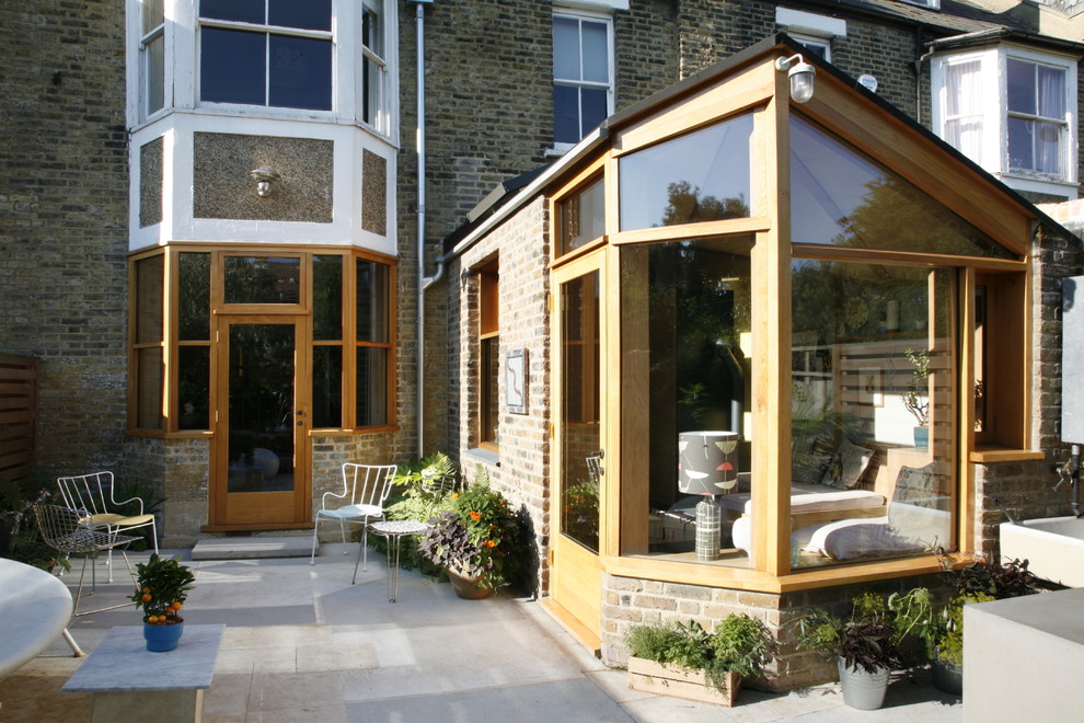 Photo of a victorian brick and rear extension in London with three floors.