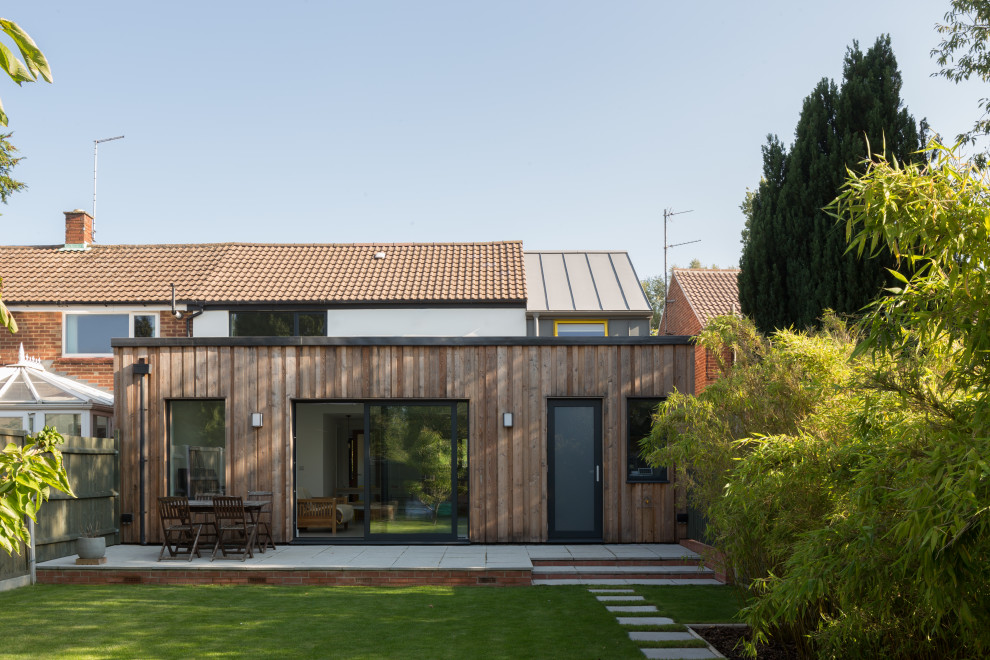 Inspiration for a medium sized and white contemporary two floor semi-detached house in Cambridgeshire with mixed cladding, a pitched roof, a metal roof and a grey roof.