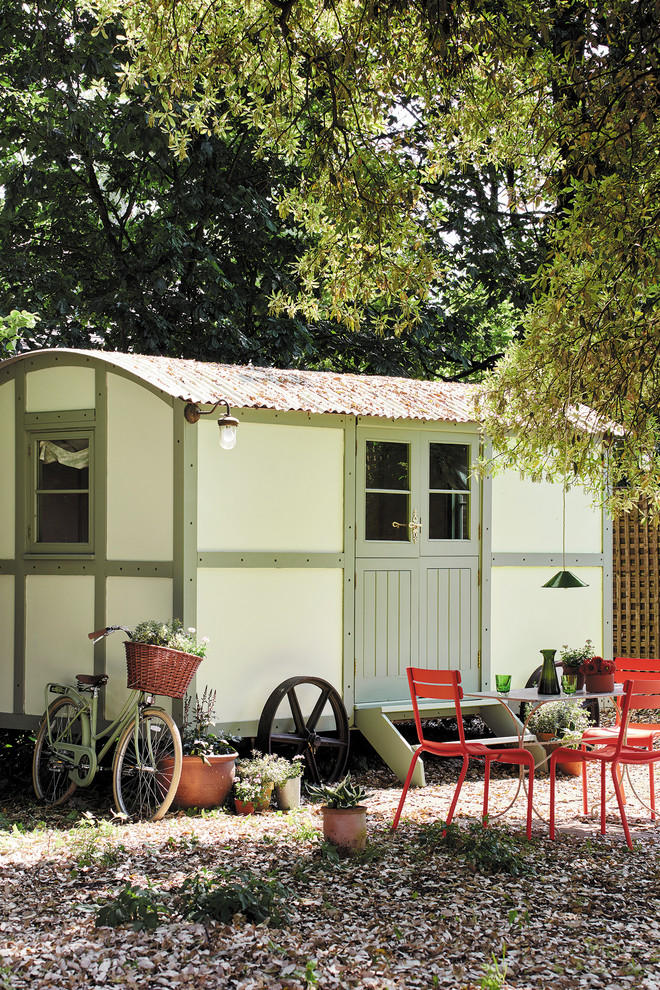Inspiration for a shabby-chic style detached garden shed and building in Moscow.