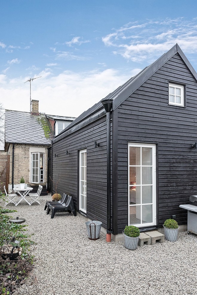 Black scandi house exterior in Malmo with wood cladding.