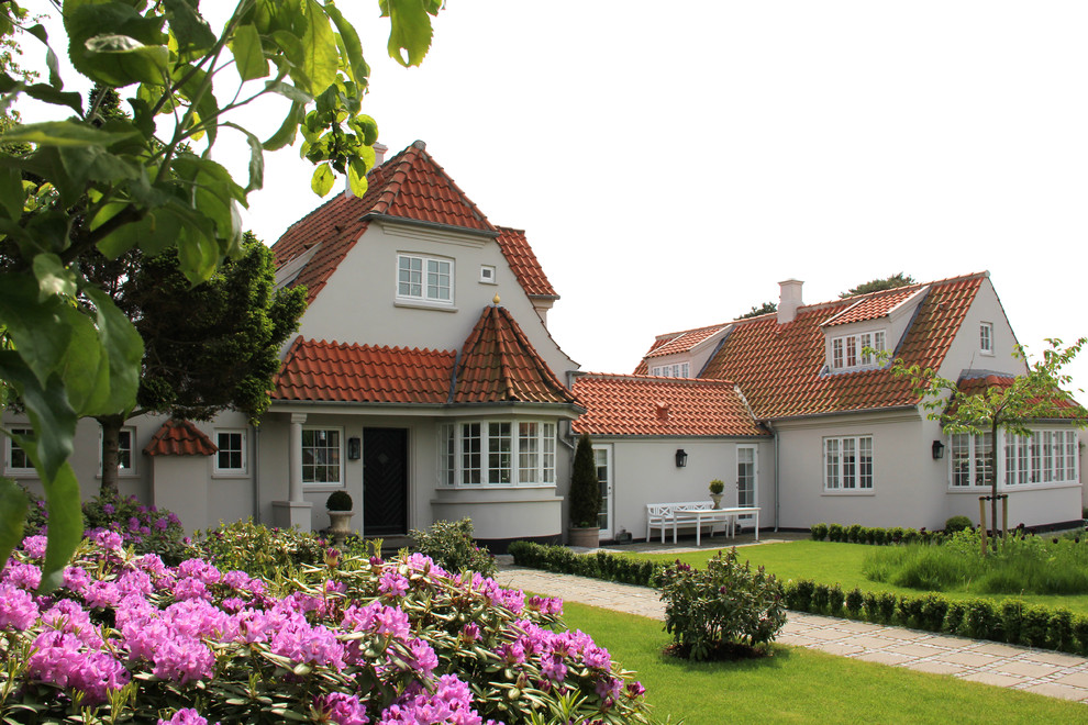Inspiration for a gey scandinavian two floor house exterior in Copenhagen.