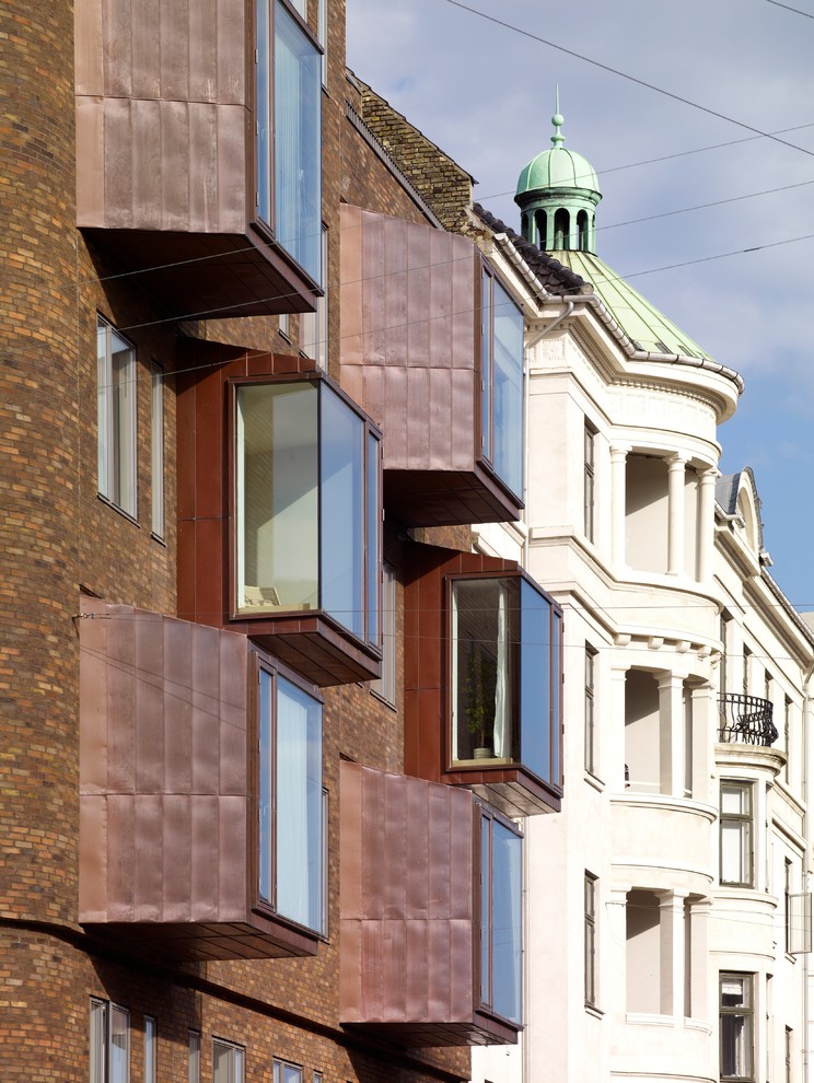 Example of a brick exterior home design in Copenhagen