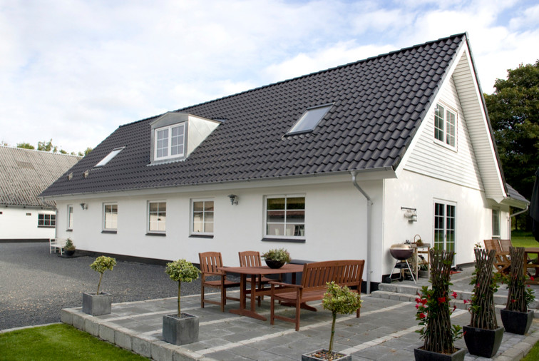 Transitional exterior home idea in Odense