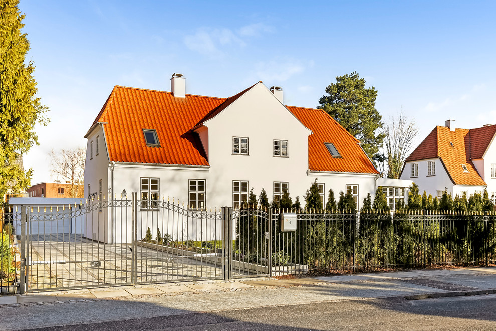 Inspiration for a large and white classic two floor brick house exterior in Copenhagen.