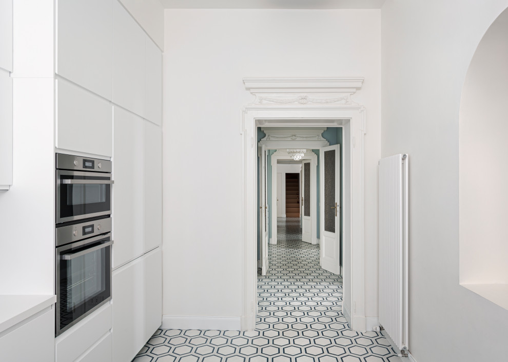 Example of a large classic hallway design in Milan with white walls