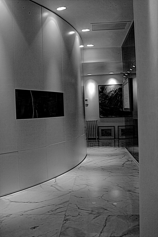 Example of a mid-sized eclectic marble floor and white floor hallway design in Rome with multicolored walls