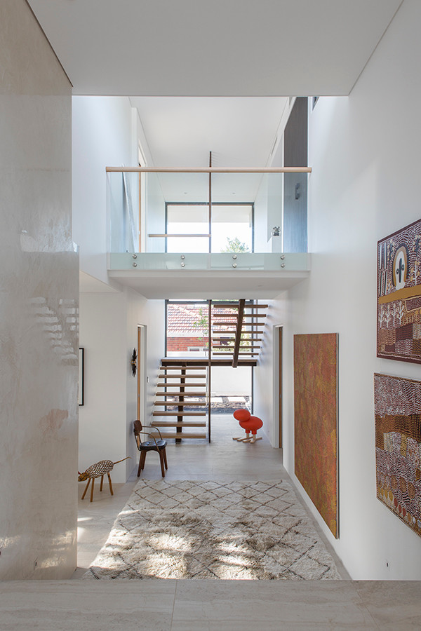 Photo of a large contemporary foyer in Perth with white walls and ceramic flooring.