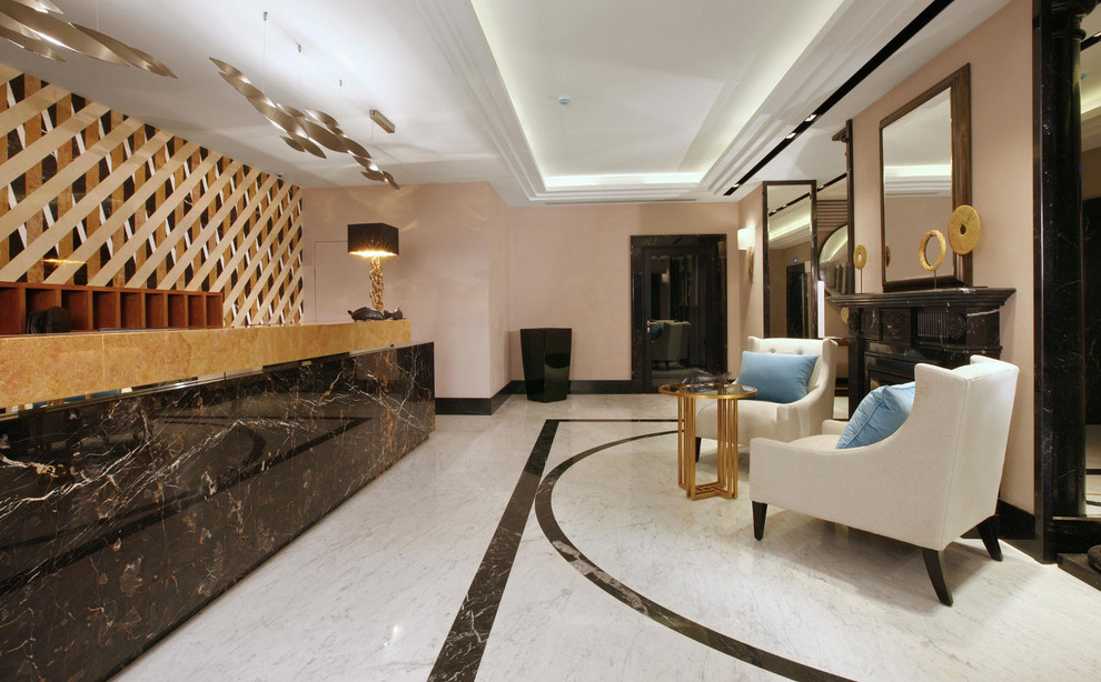 Marble inlaid wall tiles for lobby designs Condo Lobby by Renovatio