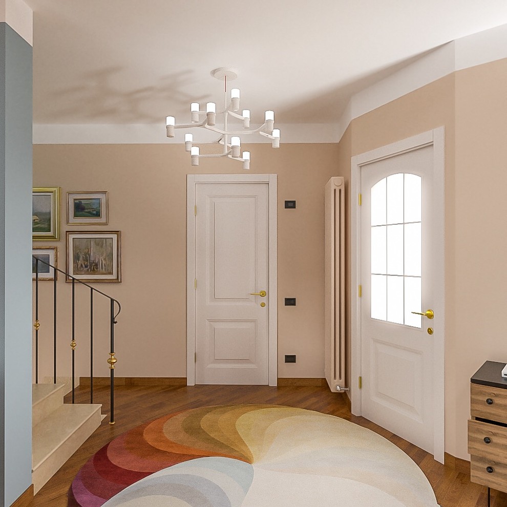 This is an example of a medium sized contemporary foyer with pink walls, dark hardwood flooring, a single front door and a white front door.