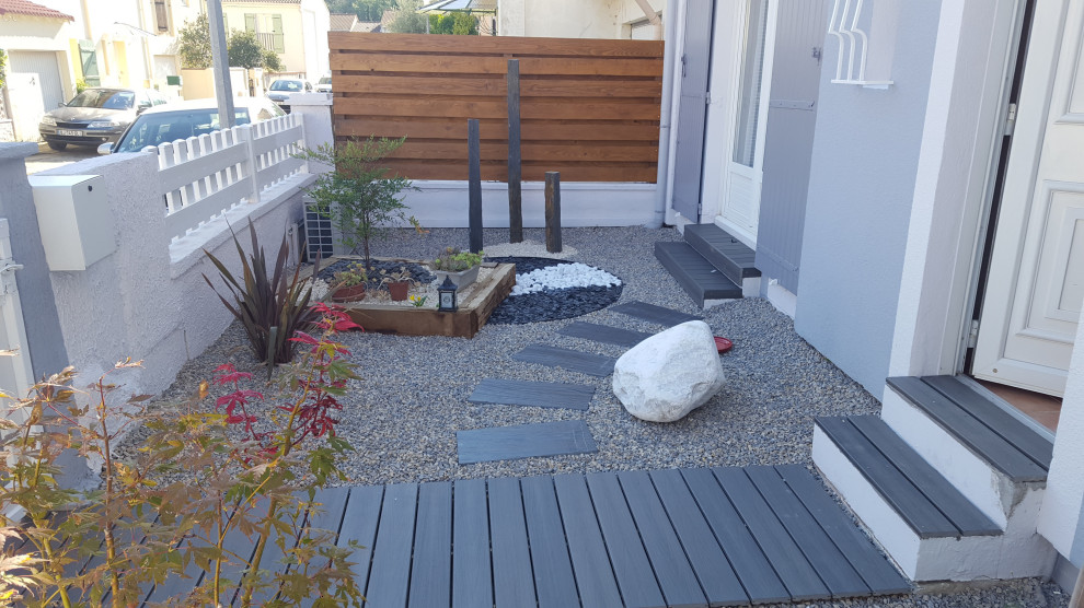Design ideas for a contemporary front full sun garden in Other with a garden path and gravel.