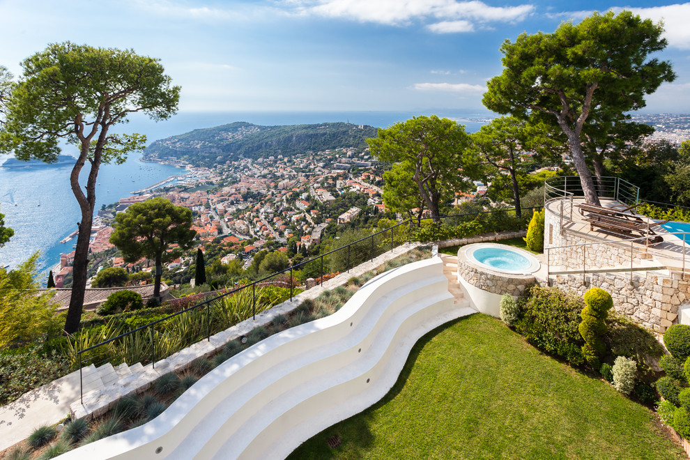 This is an example of a huge contemporary backyard landscaping in Nice.