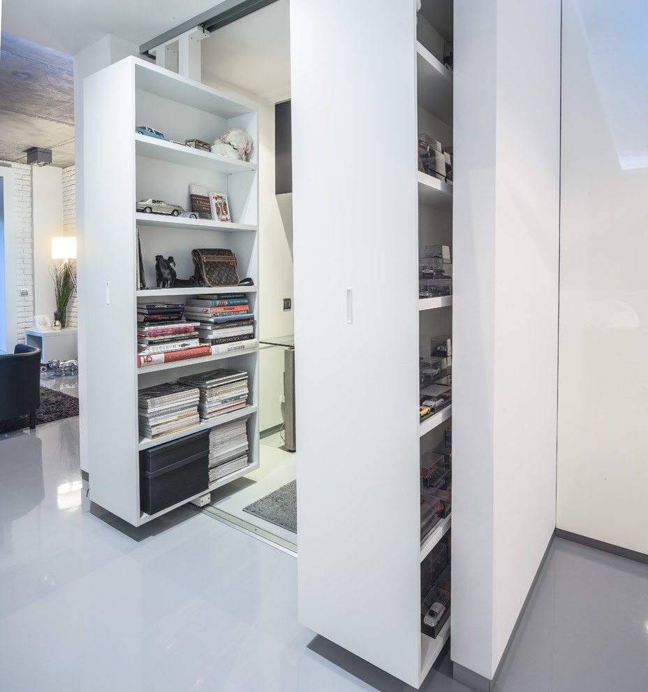 Foto di un piccolo ufficio contemporaneo con pareti bianche, pavimento in cemento e pavimento grigio