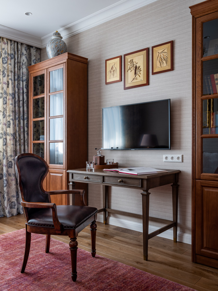 Elegant freestanding desk dark wood floor, brown floor and wallpaper home office photo in Moscow with gray walls