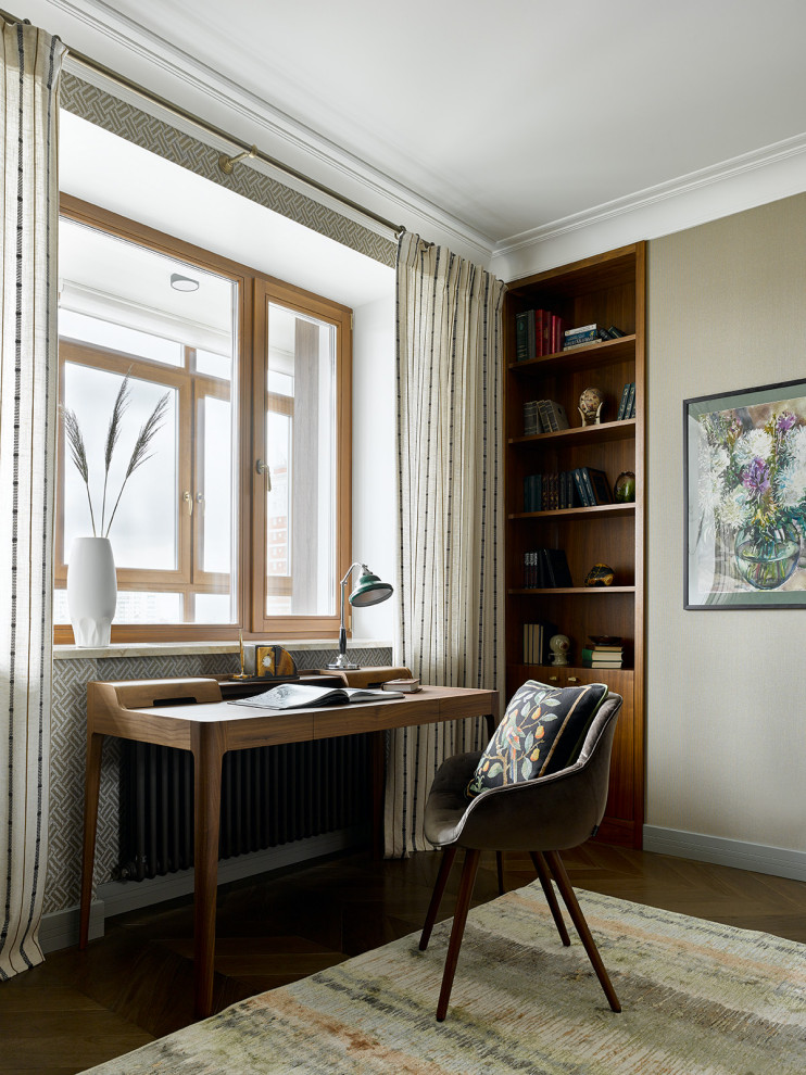 Contemporary study in Moscow with brown walls, dark hardwood flooring and a freestanding desk.
