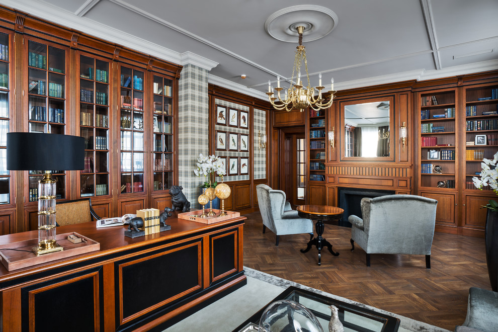 Imagen de despacho tradicional con paredes multicolor, suelo de madera oscura, todas las chimeneas, escritorio independiente y marco de chimenea de madera