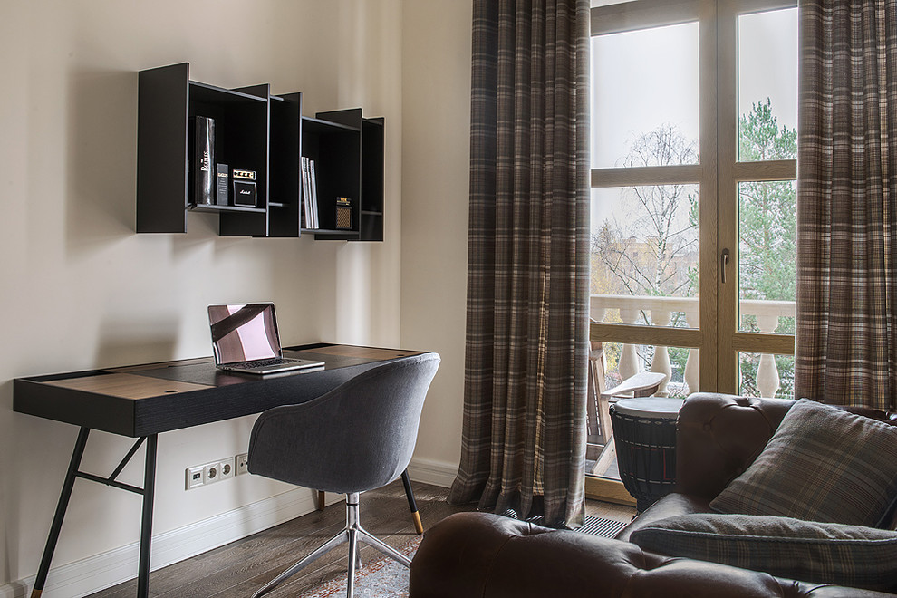 Small trendy freestanding desk medium tone wood floor and brown floor study room photo in Moscow with beige walls