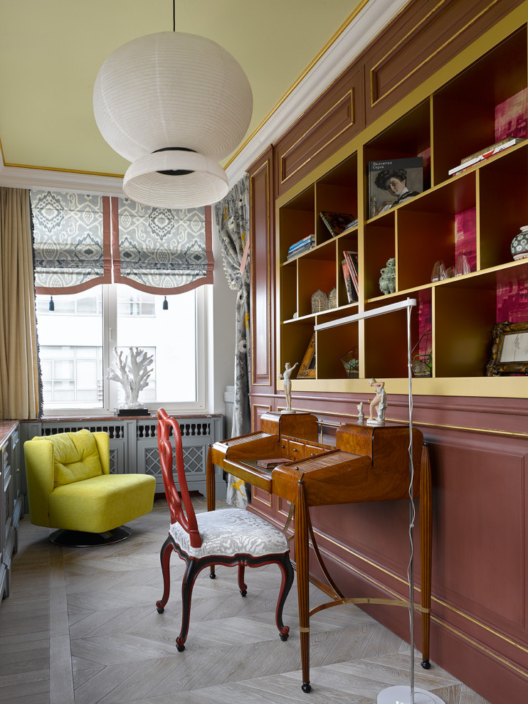 Bohemian study in Other with light hardwood flooring, a freestanding desk and beige floors.