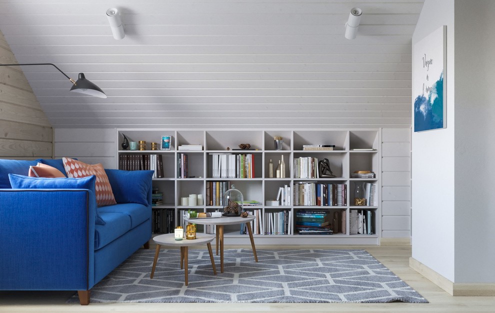 Ejemplo de despacho nórdico de tamaño medio con biblioteca y suelo laminado