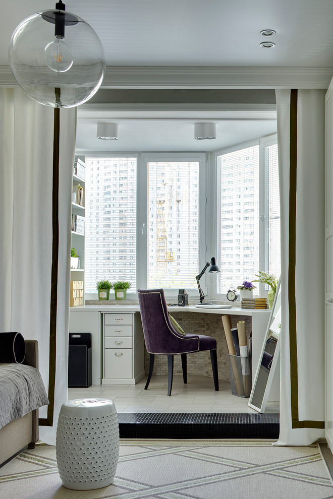 Contemporary study in Moscow with a built-in desk and beige floors.