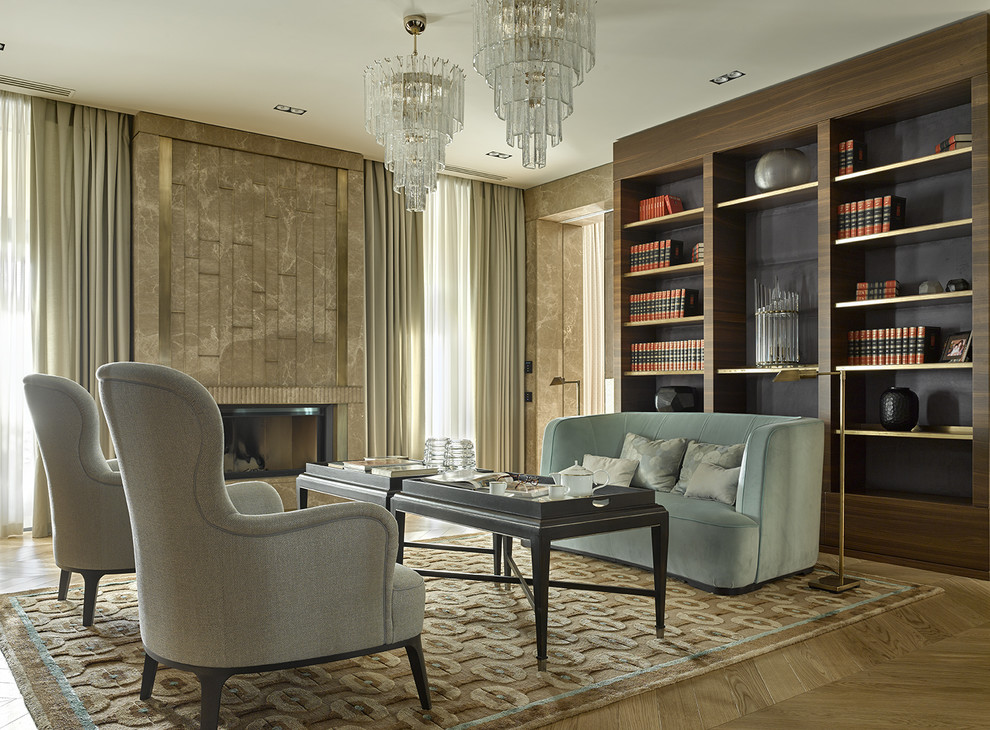 Idée de décoration pour un bureau tradition avec une bibliothèque ou un coin lecture, parquet clair et une cheminée ribbon.