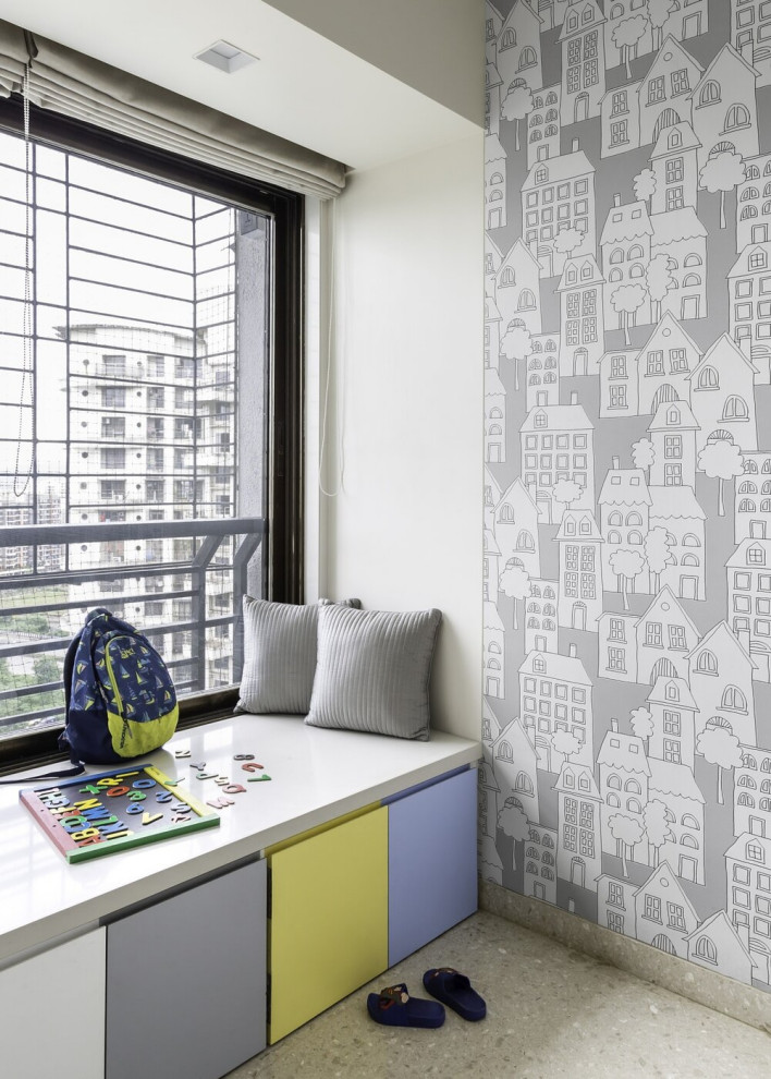 Photo of a medium sized contemporary kids' bedroom for boys in Mumbai with beige walls and beige floors.