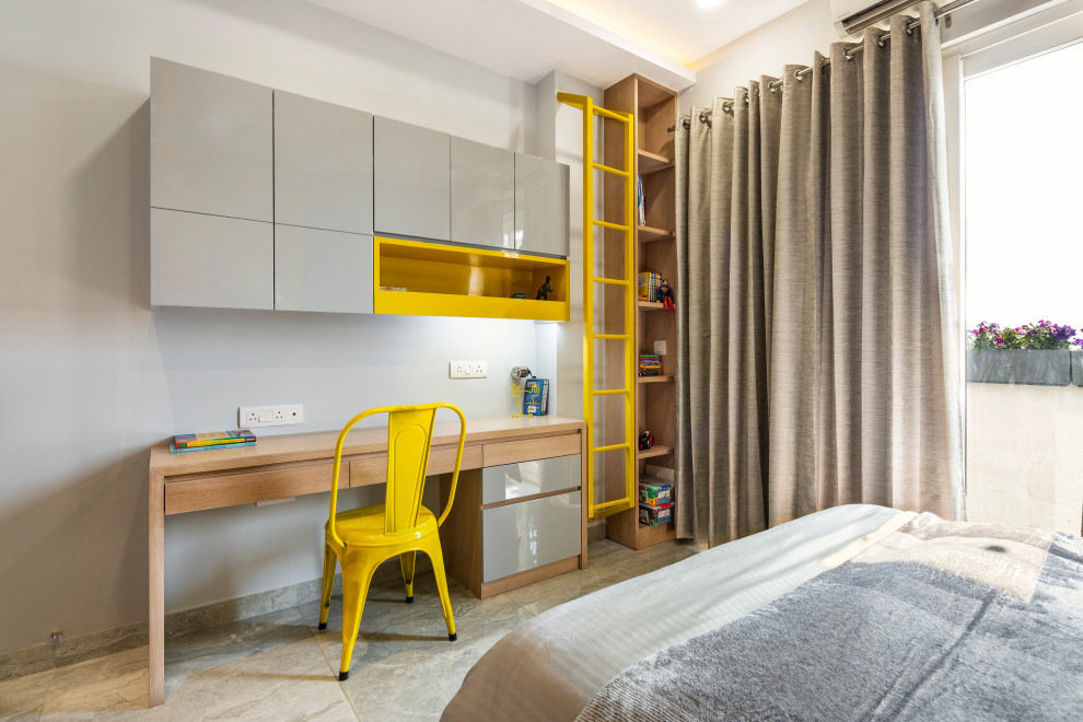 Foto di una cameretta per bambini design di medie dimensioni con pareti grigie e pavimento grigio