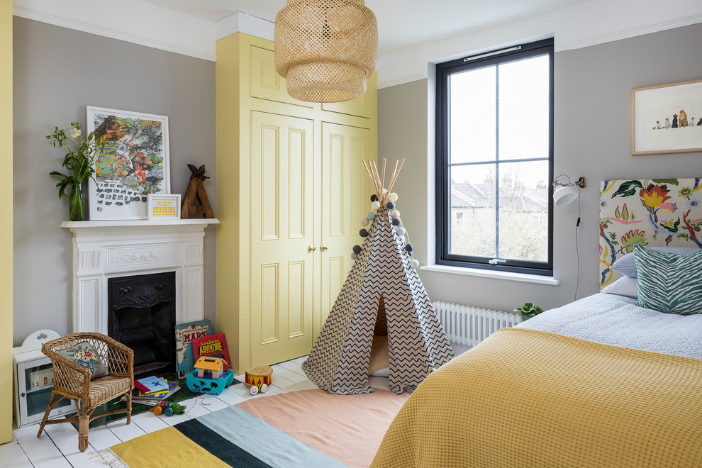 Design ideas for a scandinavian kids' bedroom in London with grey walls, painted wood flooring, white floors and feature lighting.