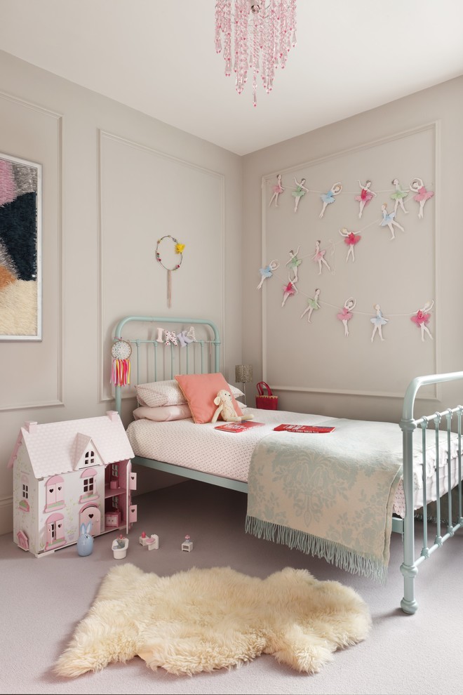 Design ideas for a classic kids' bedroom for girls in London with beige walls and carpet.