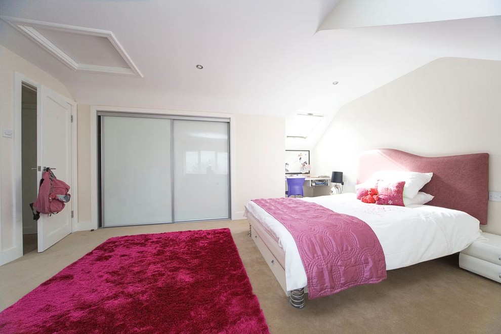 Design ideas for a medium sized contemporary teen’s room for girls in Dublin with white walls and carpet.
