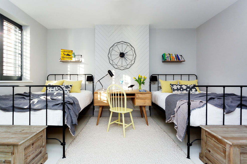 Immagine di una cameretta da letto moderna con pareti grigie