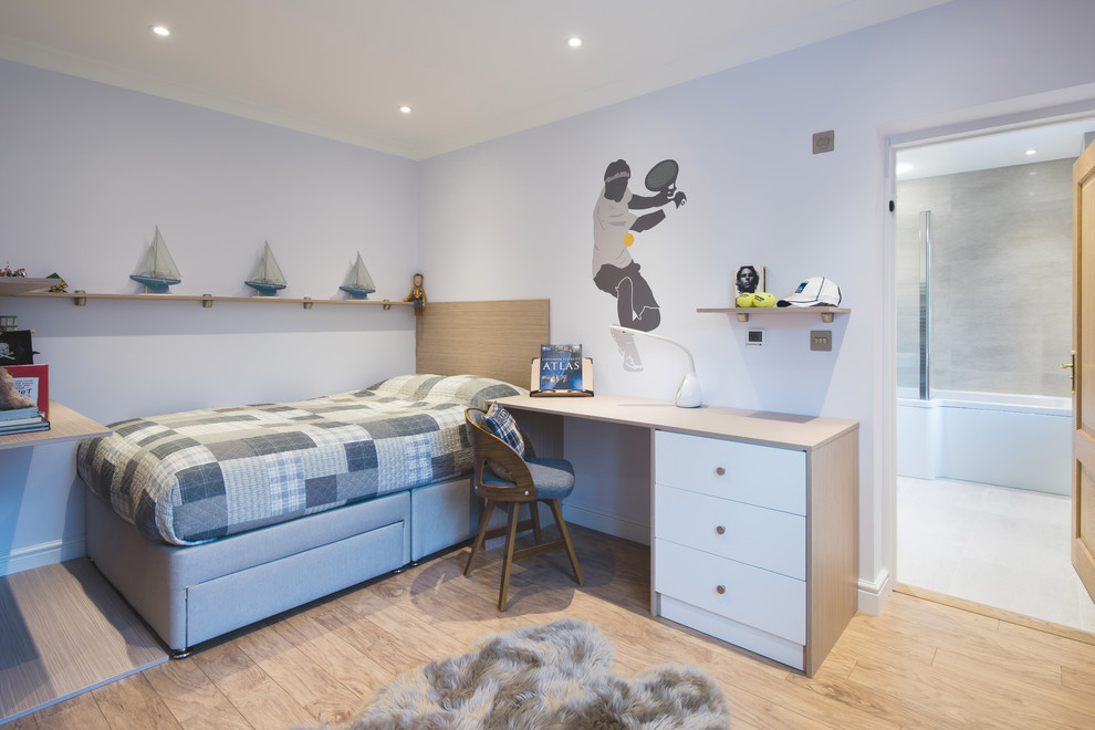Design ideas for a medium sized contemporary children’s room for boys in West Midlands with white walls, laminate floors and beige floors.