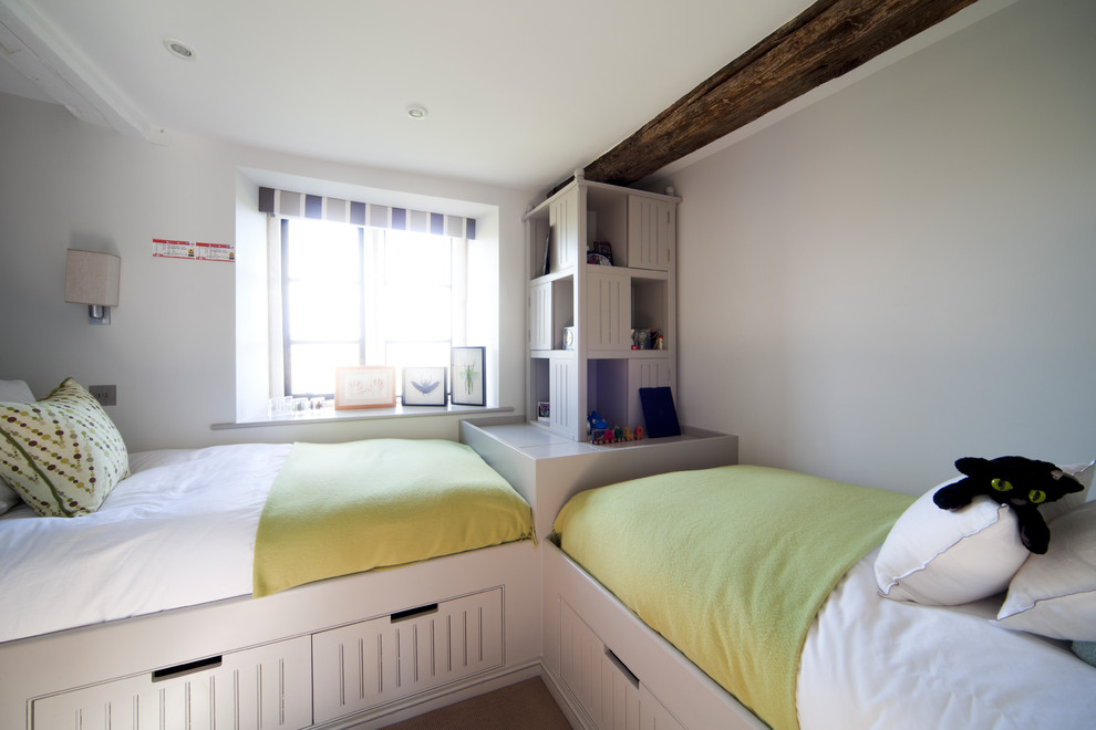 Photo of a small contemporary gender neutral kids' bedroom in London with grey walls.