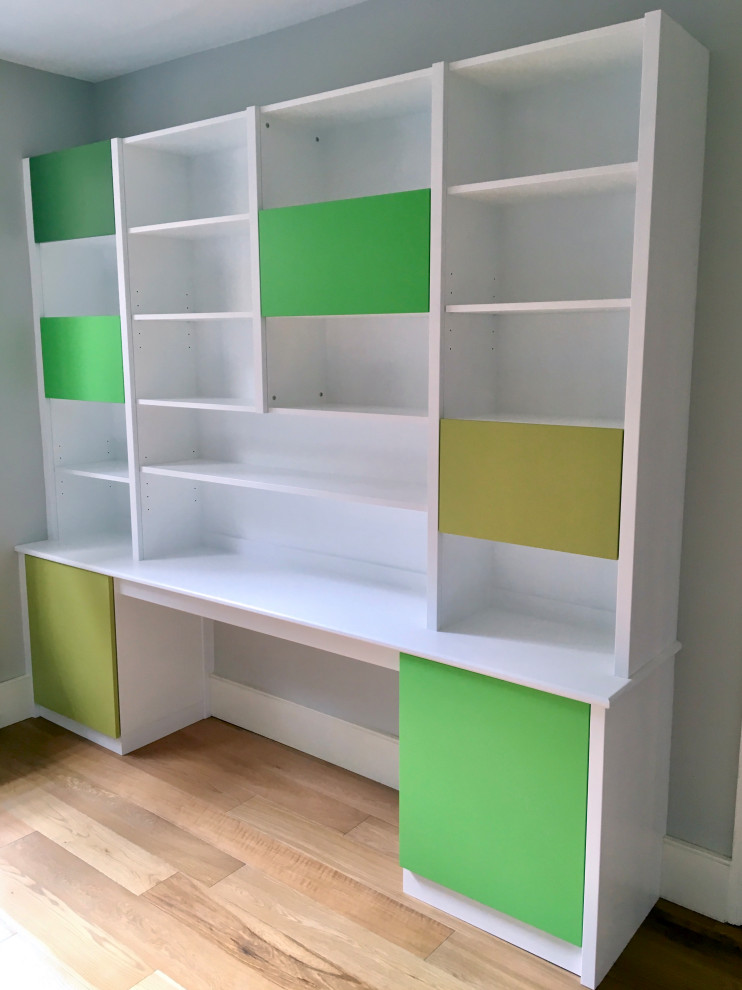 This is an example of a large contemporary playroom in London with light hardwood flooring.