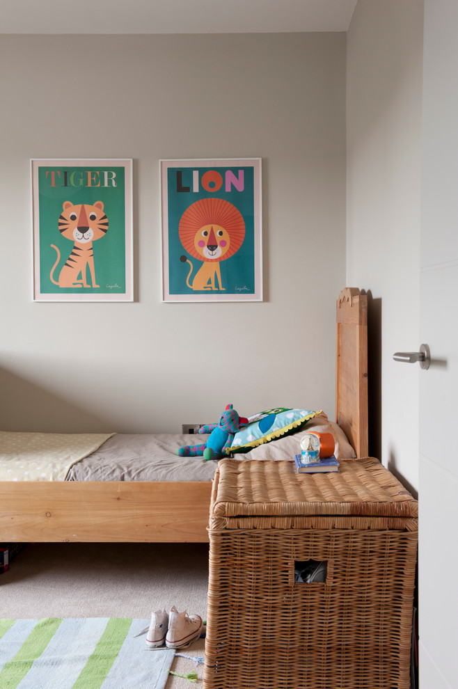 Scandinavian gender neutral children’s room in Belfast with grey walls and carpet.