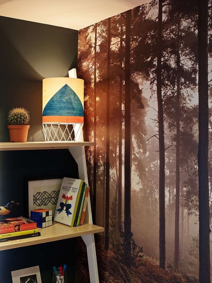 Medium sized contemporary gender neutral children’s room in London with black walls.