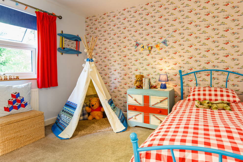 Photo of a traditional children’s room for boys in Cambridgeshire with blue walls, carpet and beige floors.