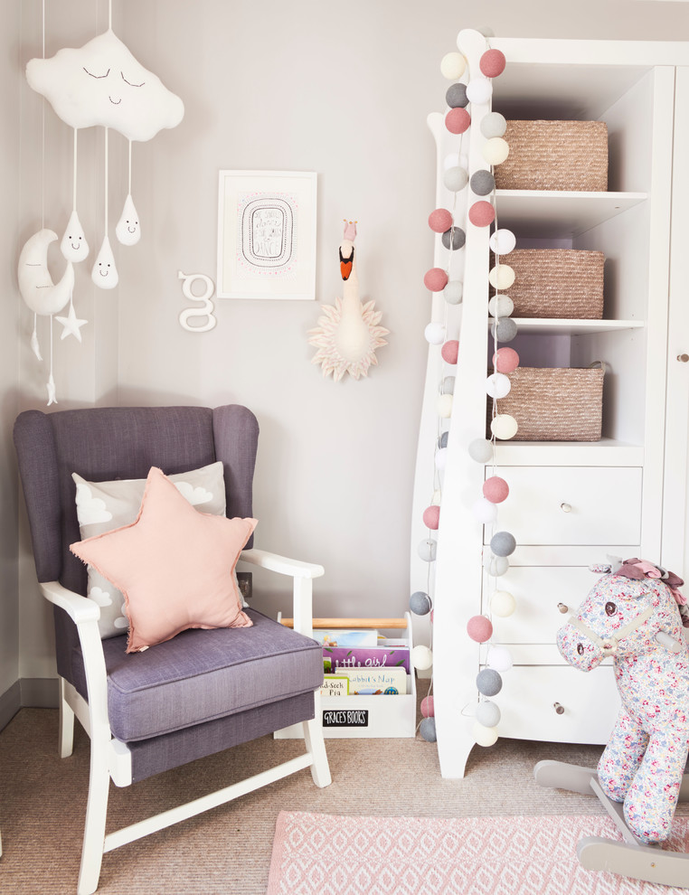 Photo of a toddler’s room for girls in Buckinghamshire with grey walls and carpet.