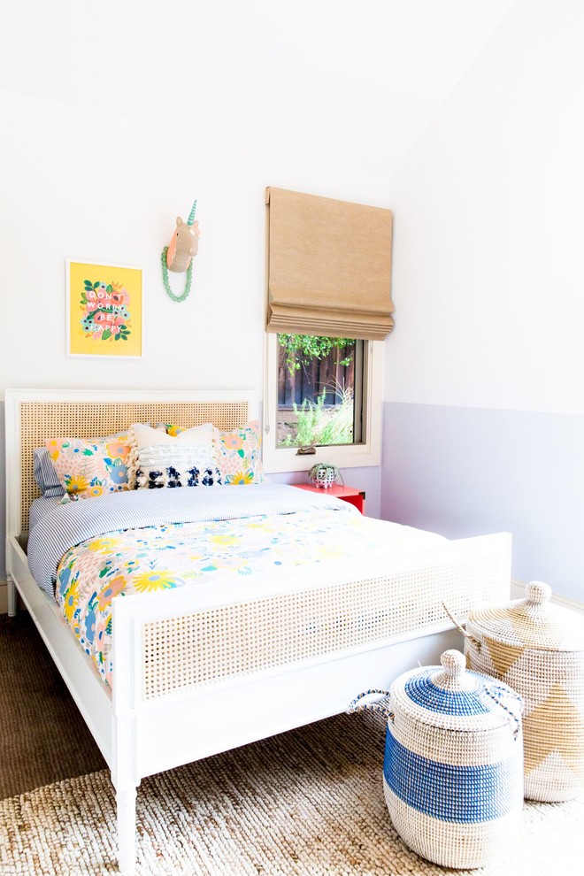 This is an example of a contemporary toddler’s room for girls in Other.