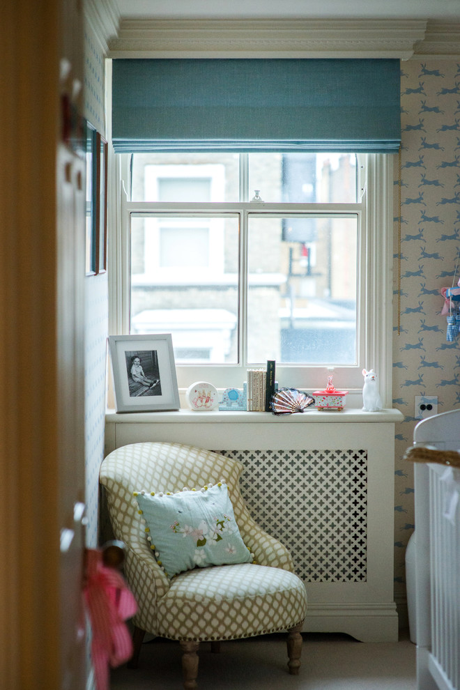 Inspiration for a timeless boy carpeted childrens' room remodel in London with beige walls