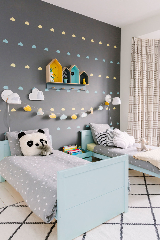 Immagine di una cameretta per bambini da 4 a 10 anni moderna con pareti grigie